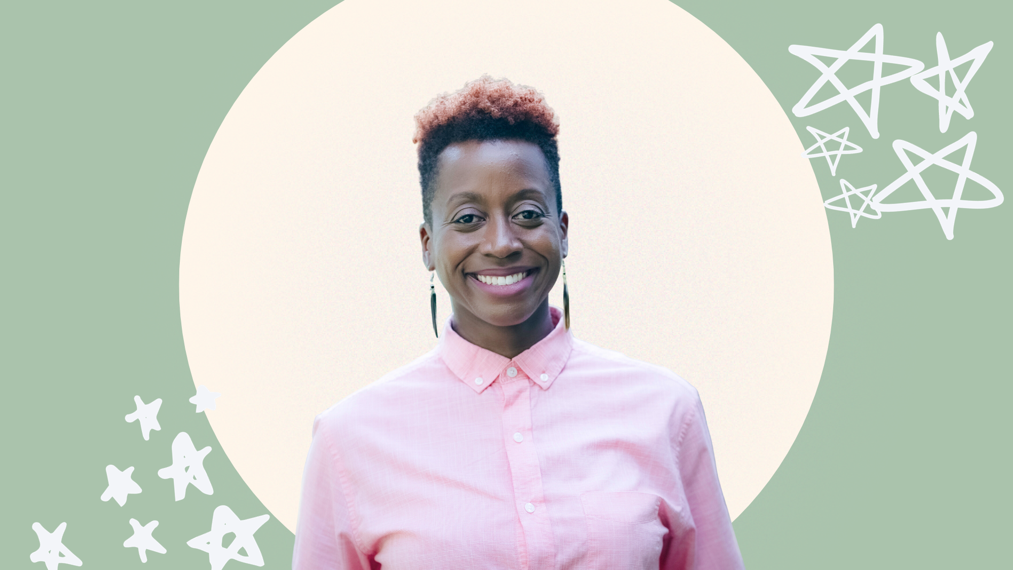 MK Abadoo, a medium brown-skinned African American person smiles. They wear a pink buttoned up shirt against a forest green background. Her black hair is in a short, tapered cut with red highlights and slender black earrings frame their wide smile.