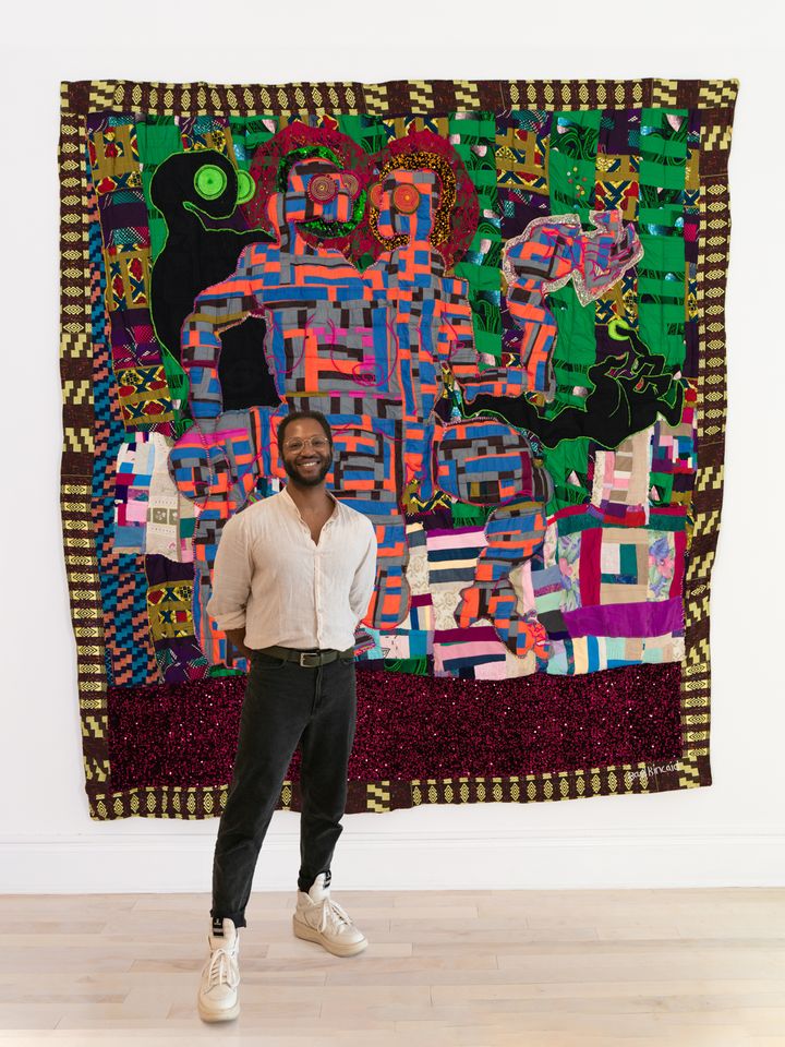Basil stands in front of their quilt made in 2022, "Grace and Glory." Credit: Venus Over Manhattan.