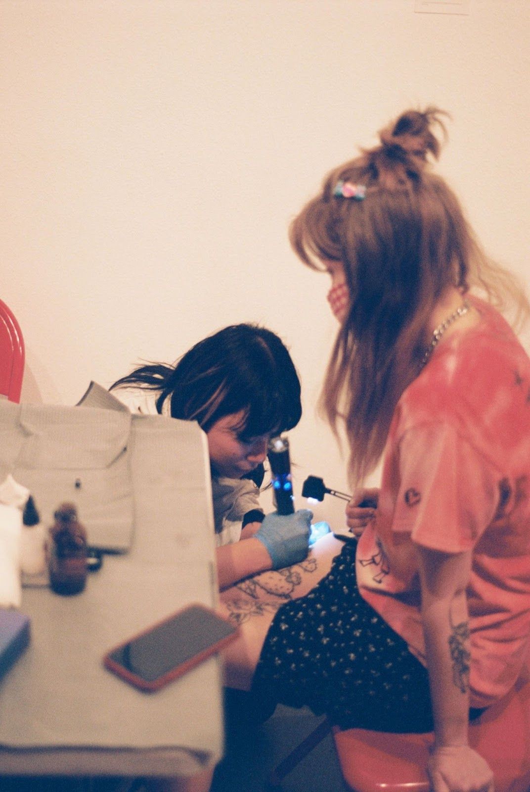 At DIY's Nuts + Bolts 2.0 event at Junior High Los Angeles, Tammy Piravej (L) tattoos Julianna Sy (R). Credit: B Munro Thompson